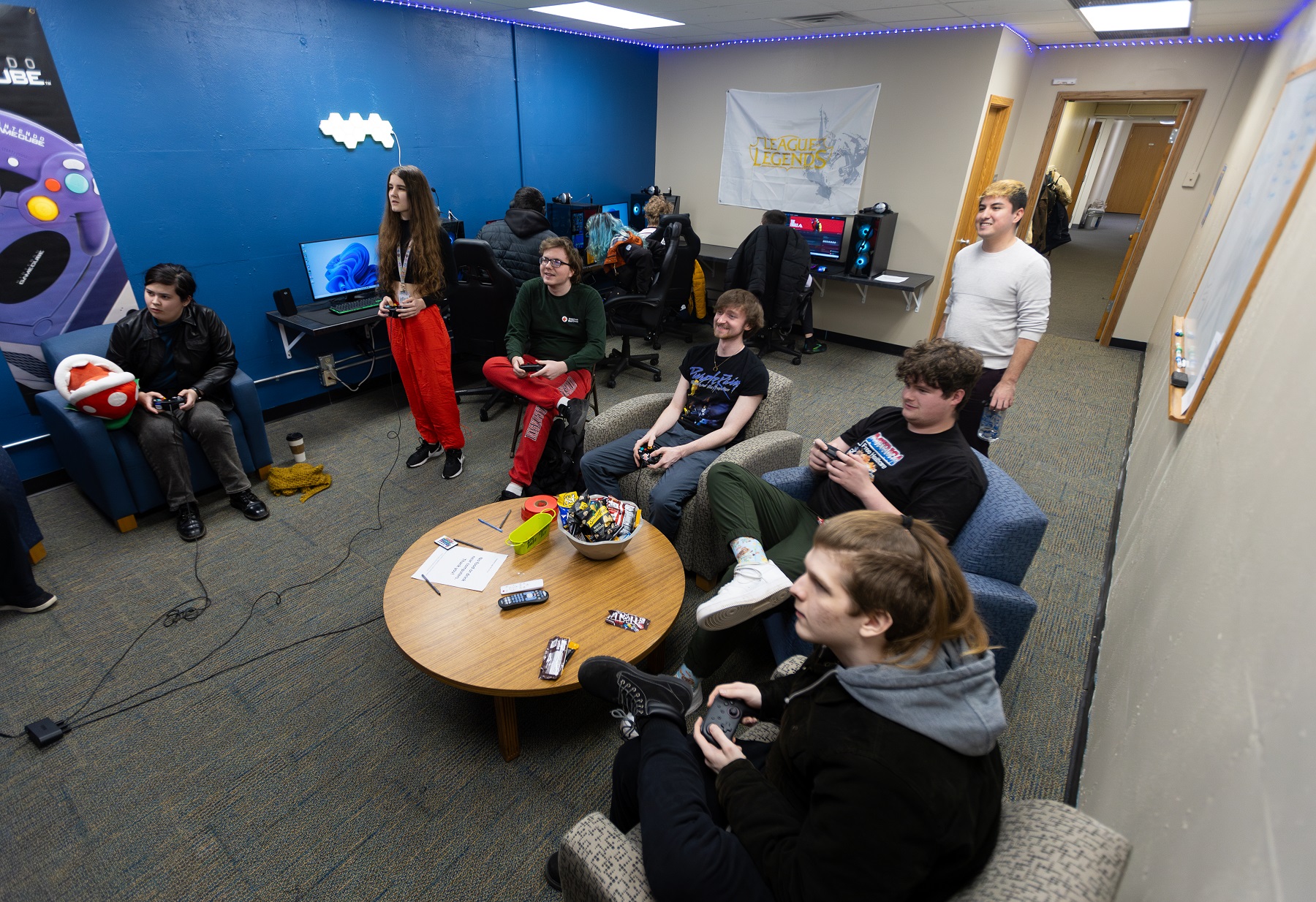 Students gather to play video games in the Esports gaming lounge.