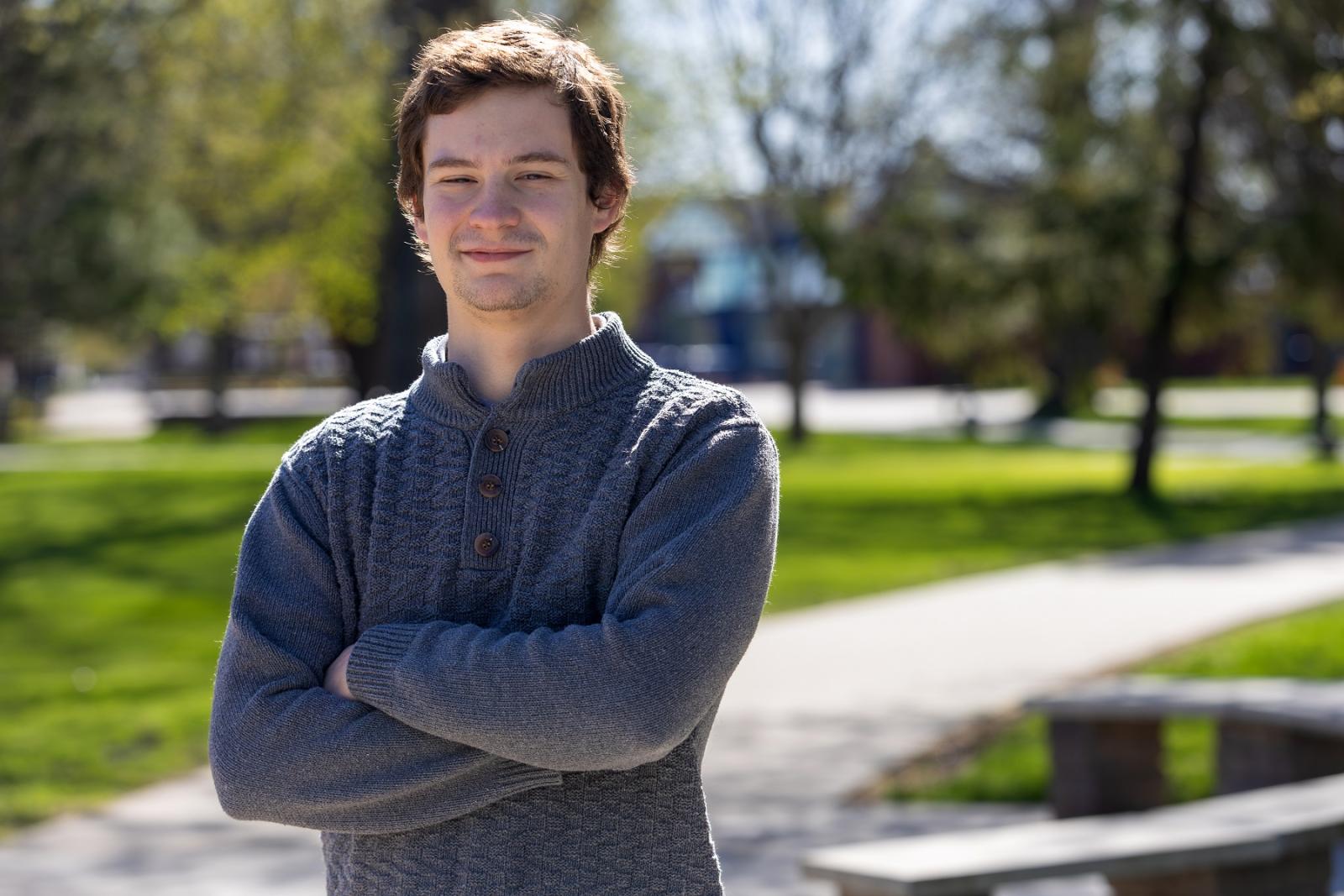 Jonathan Bass poses for a photo outside on the Lawrence campus.