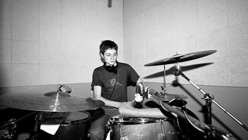 Spencer Tweedy '19 playing drums
