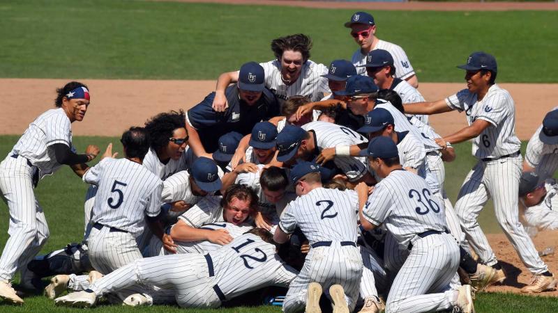 Lawrence baseball players celebrate on the infield after winning the Midwest Conference Tournament at Whiting Field.