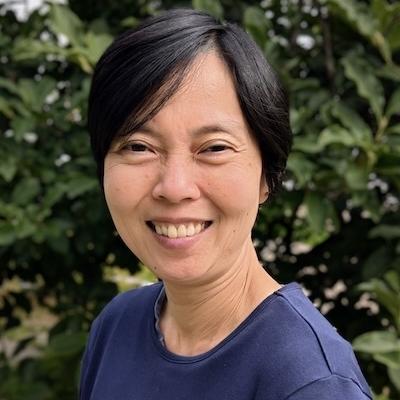 Headshot of Professor Khor against leafy backdrop