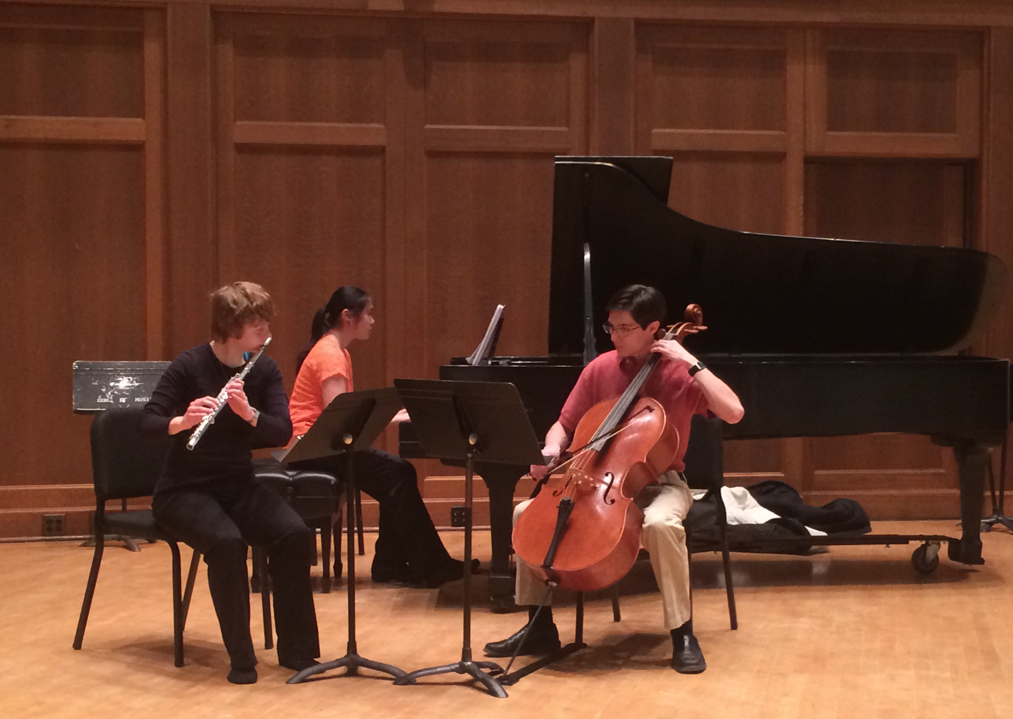 Flute, cello, and piano students performing together