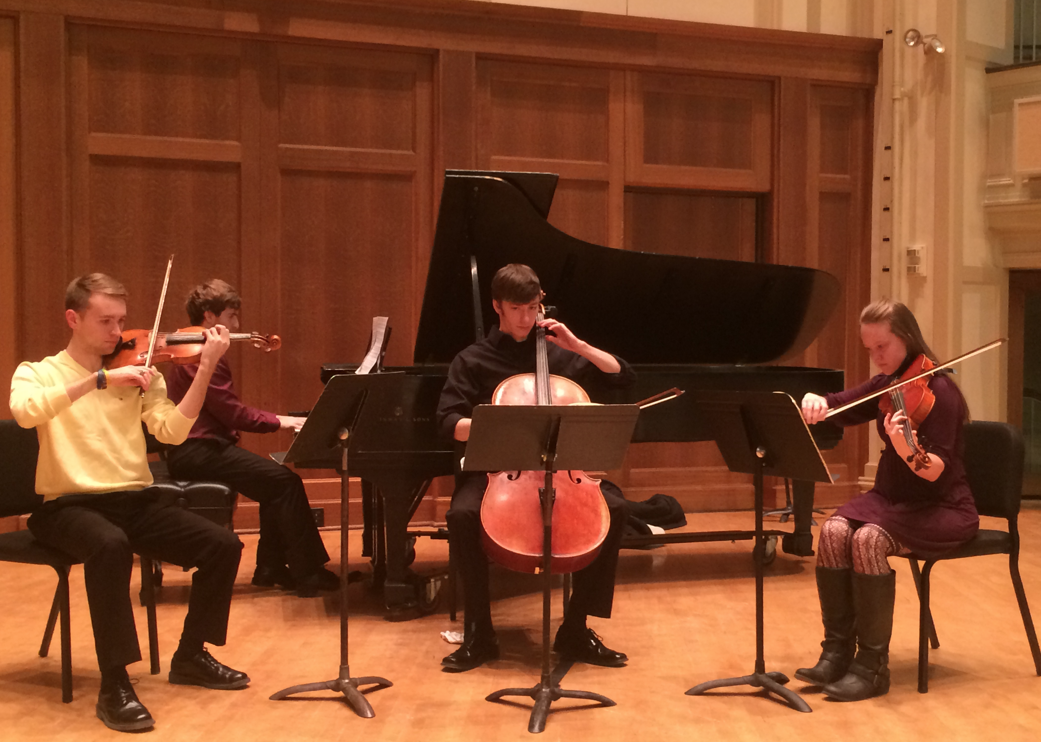 Violin, cello, and piano students performing