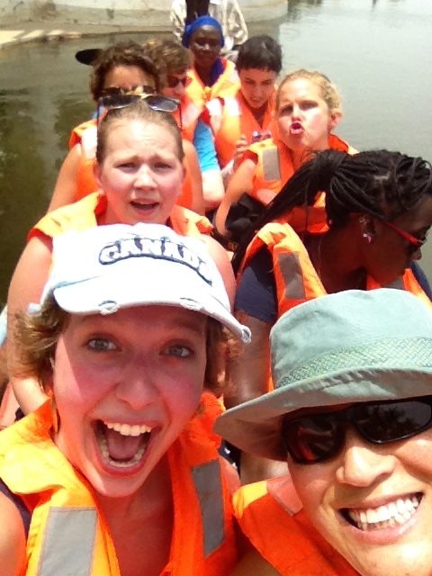 Students on boat trip wearing life jackets