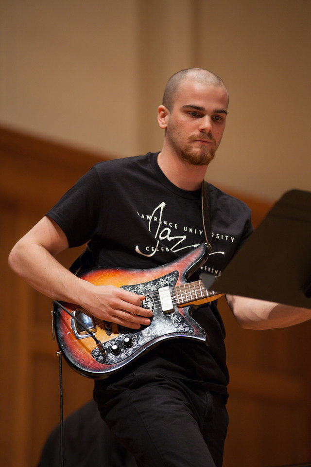 Student Sam Genualdi playing guitar