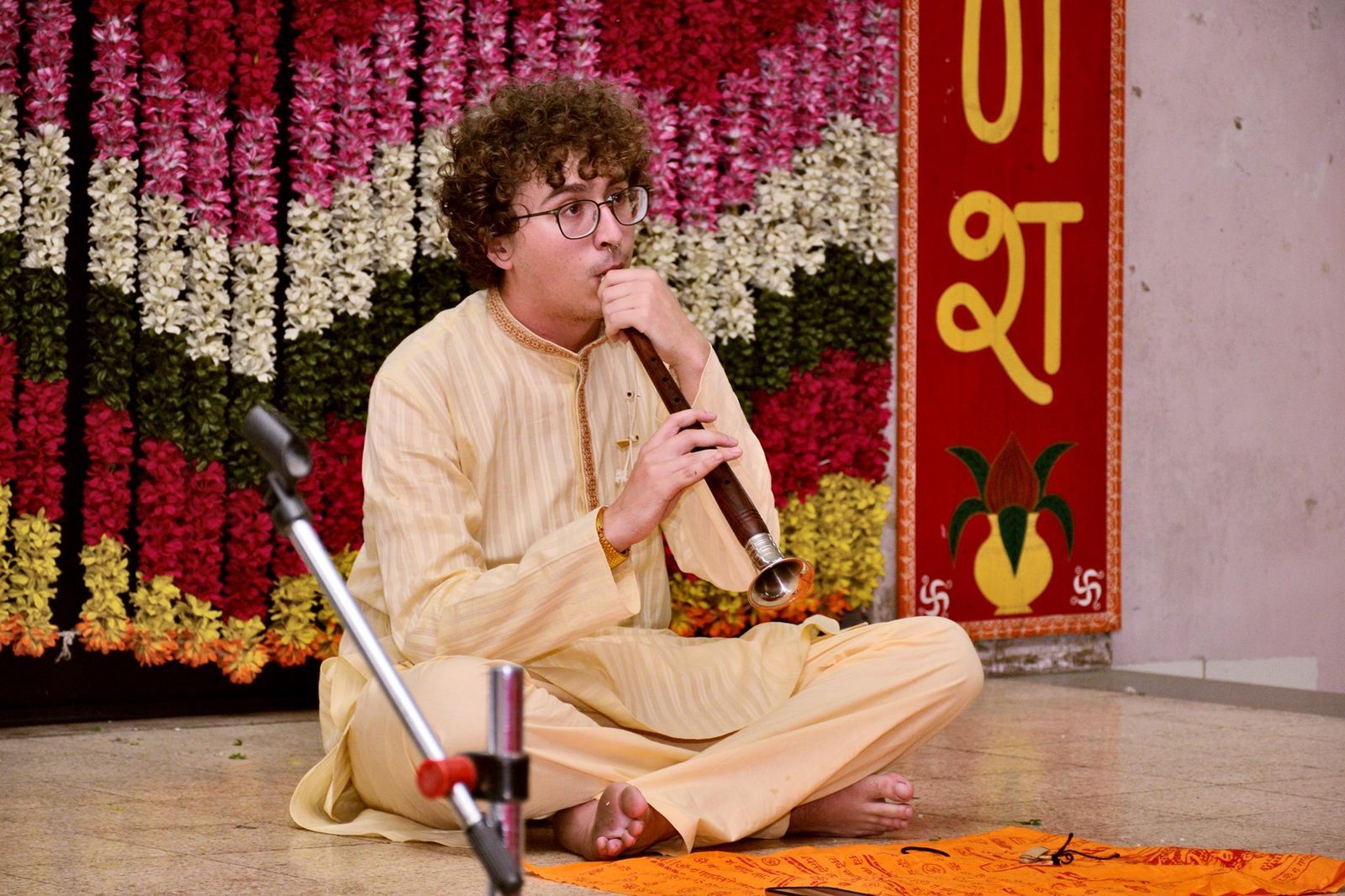 A music student performing on Shehnai, an instrument he learned as part of his program with ACM India.