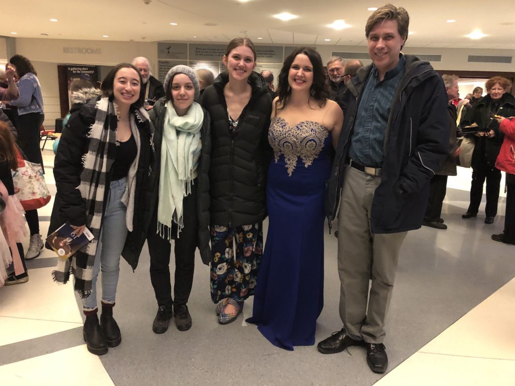 Several of Estelí Gomez's students pose with her for a photo at the Fox Cities Performing Arts Center.