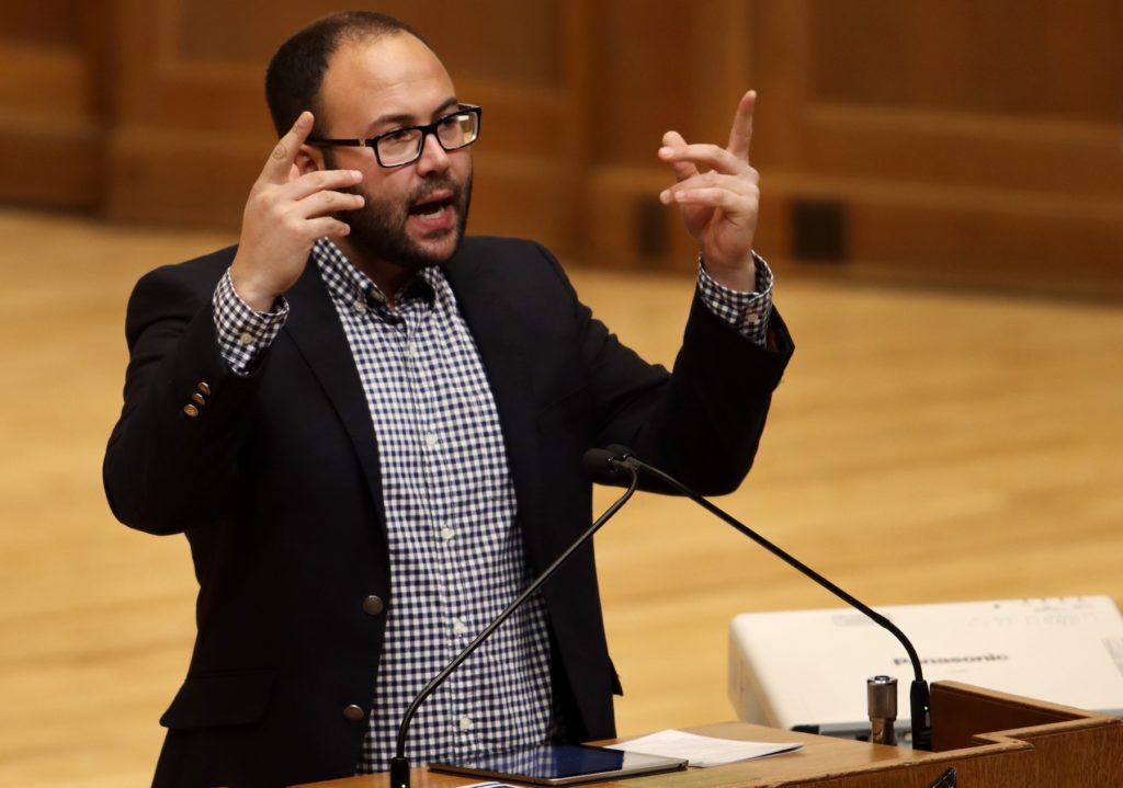 Simon Balto gestures with his hands as he speaks during Monday's MLK Celebration at Memorial Chapel. 