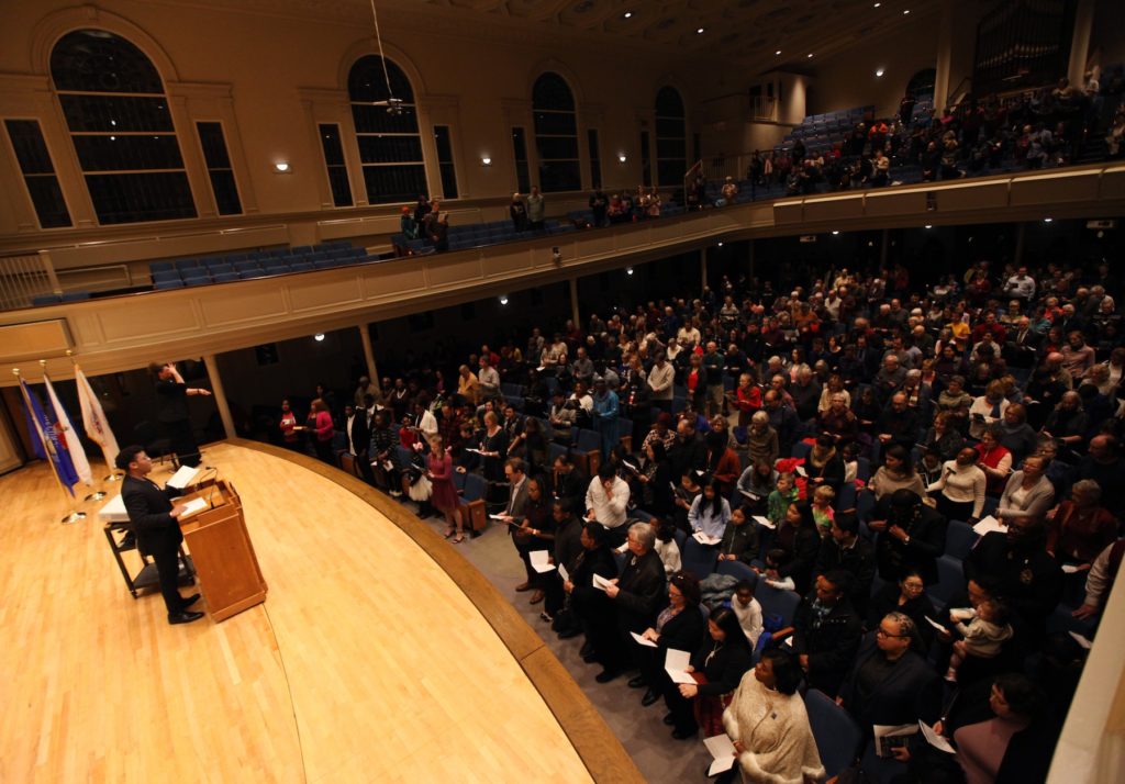 Memorial Chapel is mostly full as Lawrence student Kyree Allen sings during Monday's MLK event.