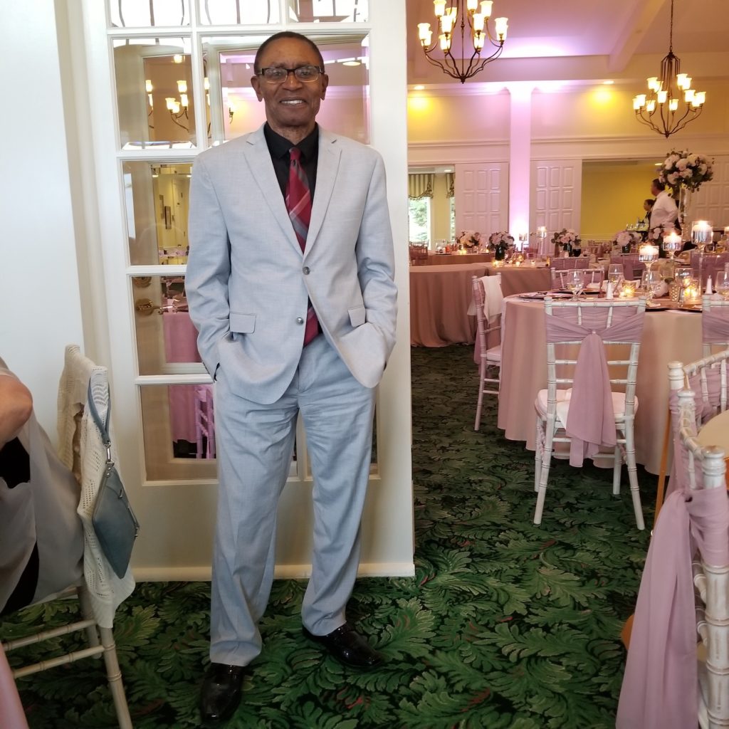 Lifongo Vetinde poses for a photo at a formal dinner event