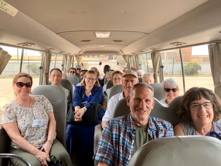 Professor Claudena Skran (center) and Stacy Mara (front left) led the alumni trip to Ghana.