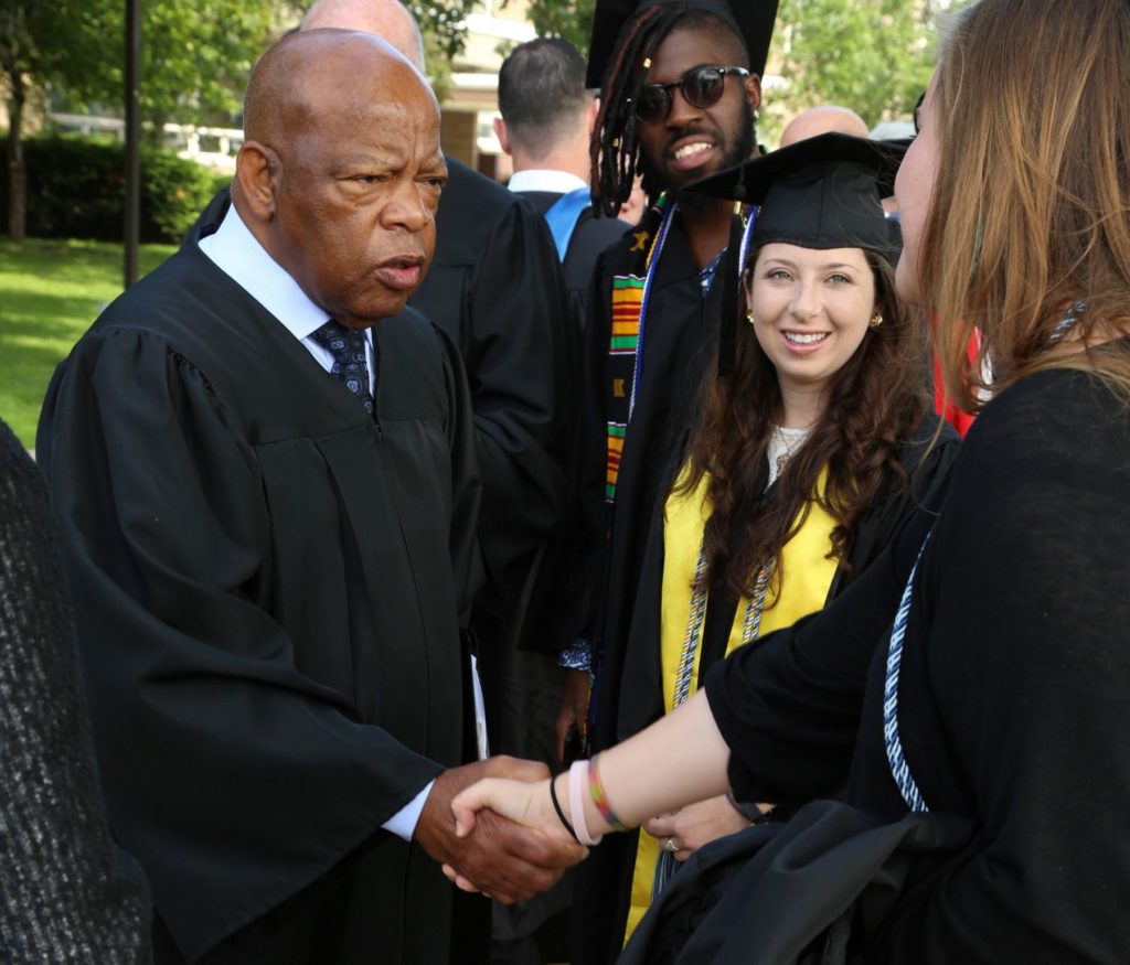 Rep. John Lewis talks with graduates and visitors to the spring Commencement in 2015.