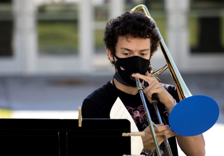 Matvei Mozhaev ’23 rehearses with other horn players in the Lawrence University Jazz Ensemble.