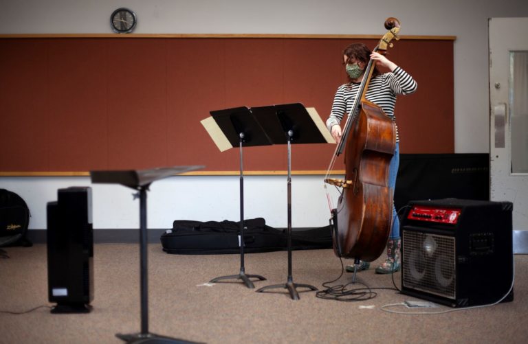 Ali Remondini ’21 practices in a Music-Drama Center room equipped with a new air filtration system (left).