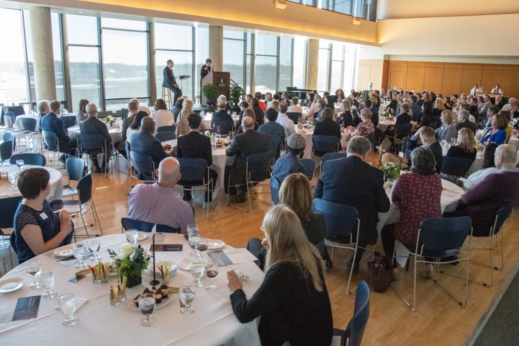 200 leaders from Fox Valley government bodies in Somerset Room, Warch Campus Center.