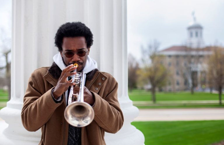 Earl Simons Jr. plays the trumpet.