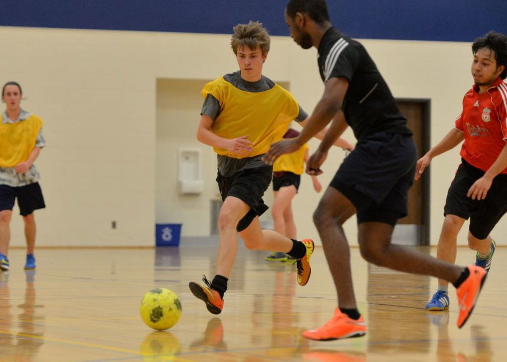 Students playing intramural soccer at  the Wellness Center 