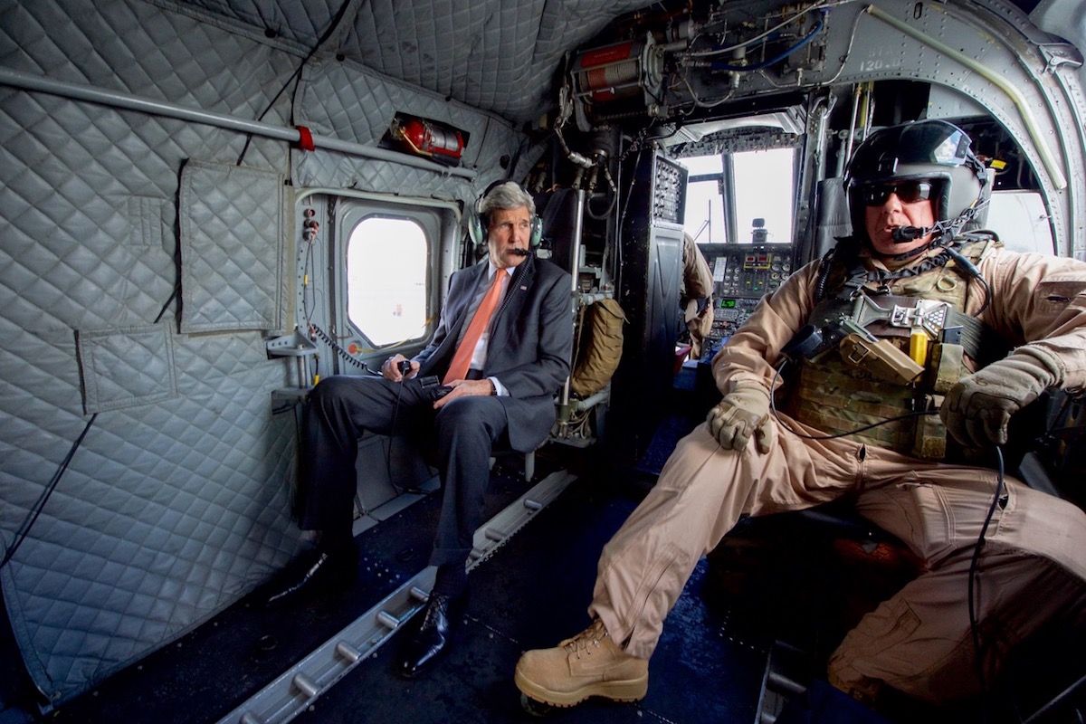 United States Secretary of State John Kerry flies in an Embassy Air Chinook helicopter