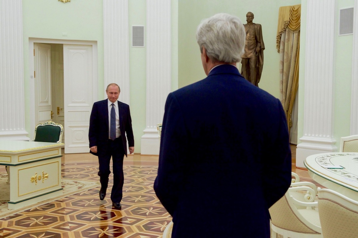 Glen Johnson ’85 during his time with Secretary of State John Kerry, including this one of Kerry meeting with Russian President Vladimir Putin
