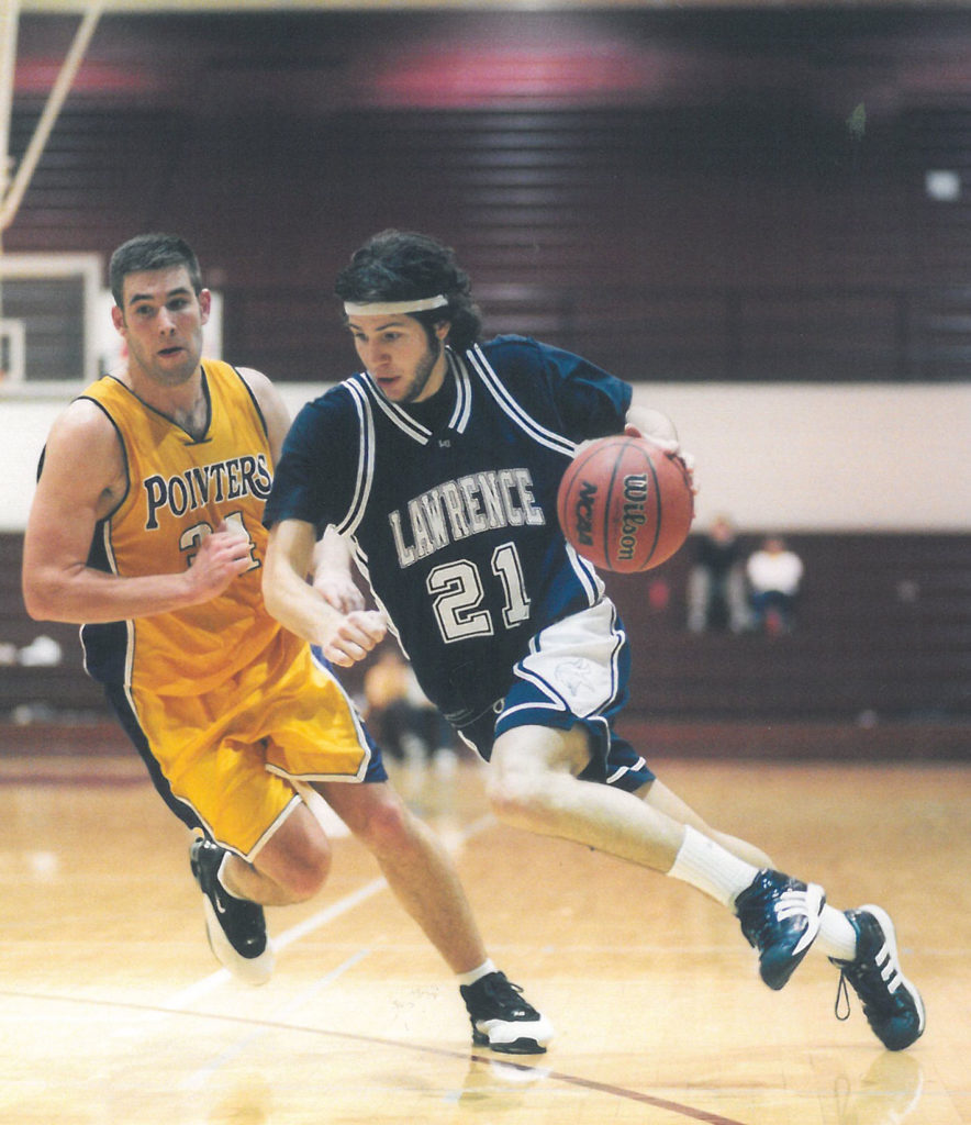 Kyle MacGillis drives to the basket against UW-Stevens Point 