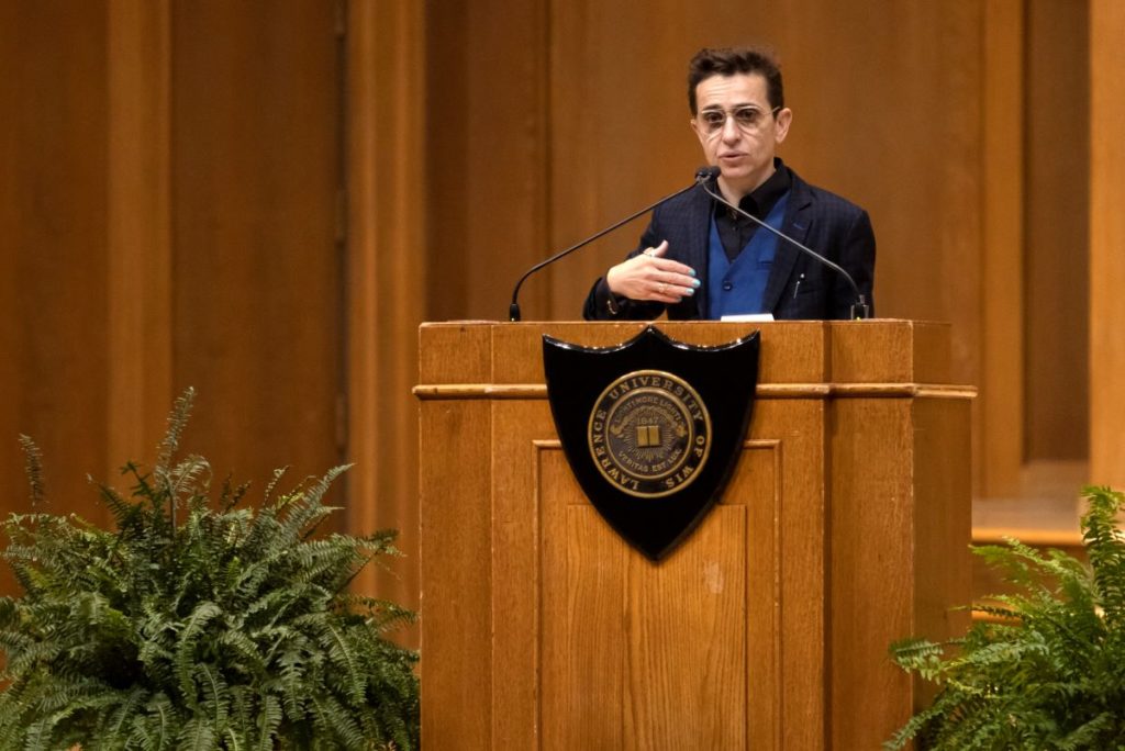 Masha Gessen behind a podium in the Chapel, addressing the Lawrence community