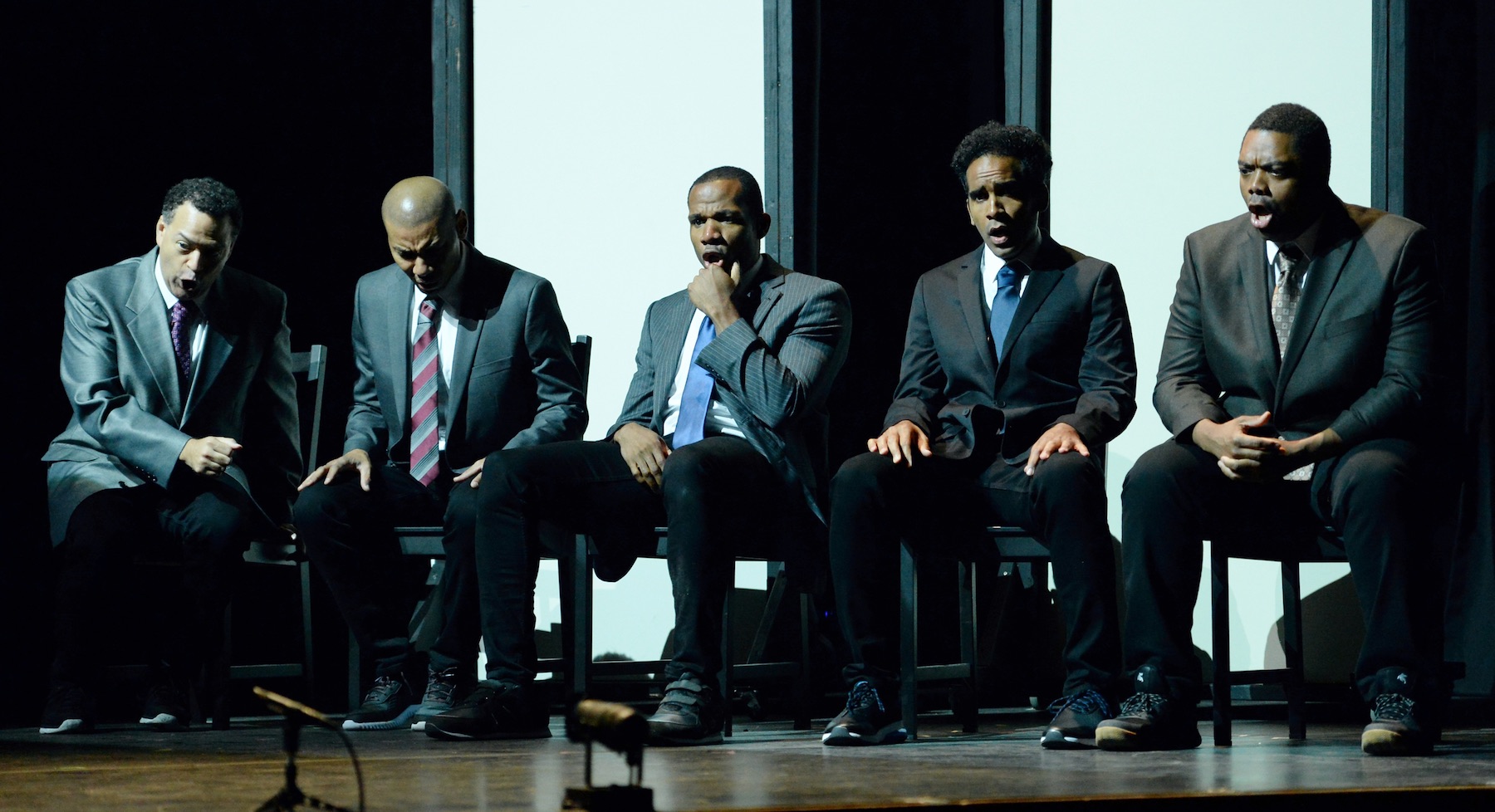 Derrell Acon ’10 (center) and his castmates in “The Central Park Five” 