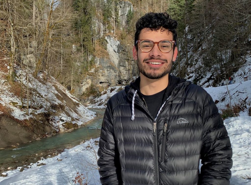 Ricardo Jimenez next to a creek and surrounded by leafless trees