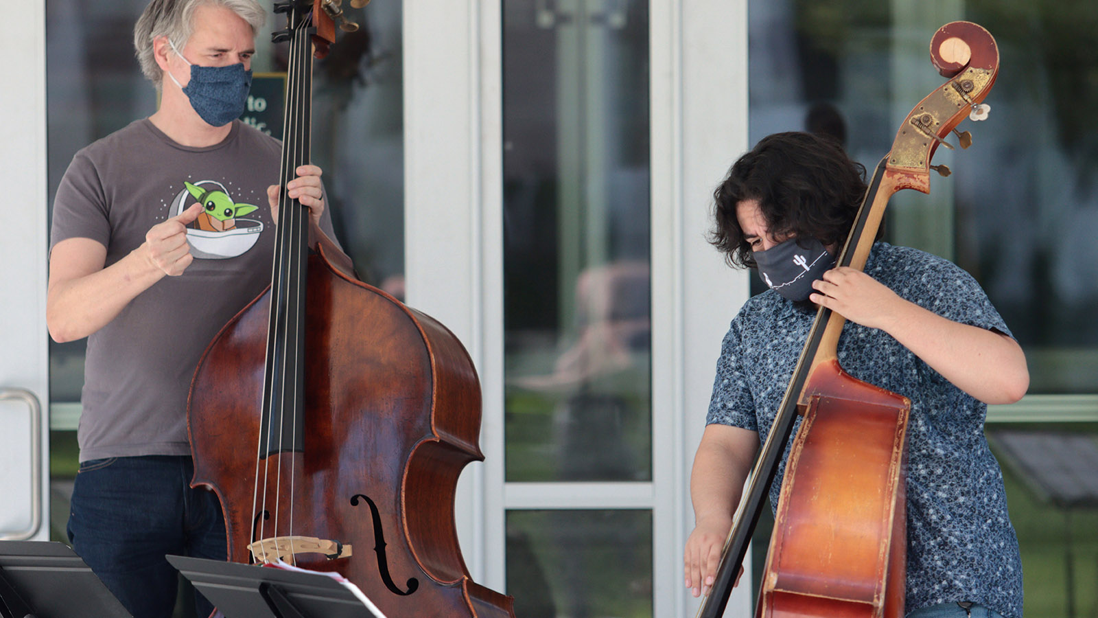 Mark Urness, Associate Professor of Music, works with Jando Valdez ’24 during the Double Bass Studio class