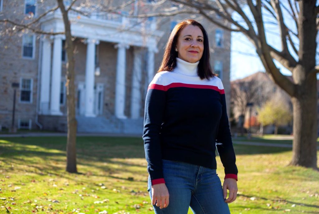 Professor Tapia with Main Hall in the background 