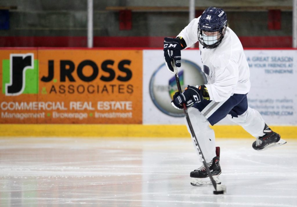 hockey player dribbling the puck 