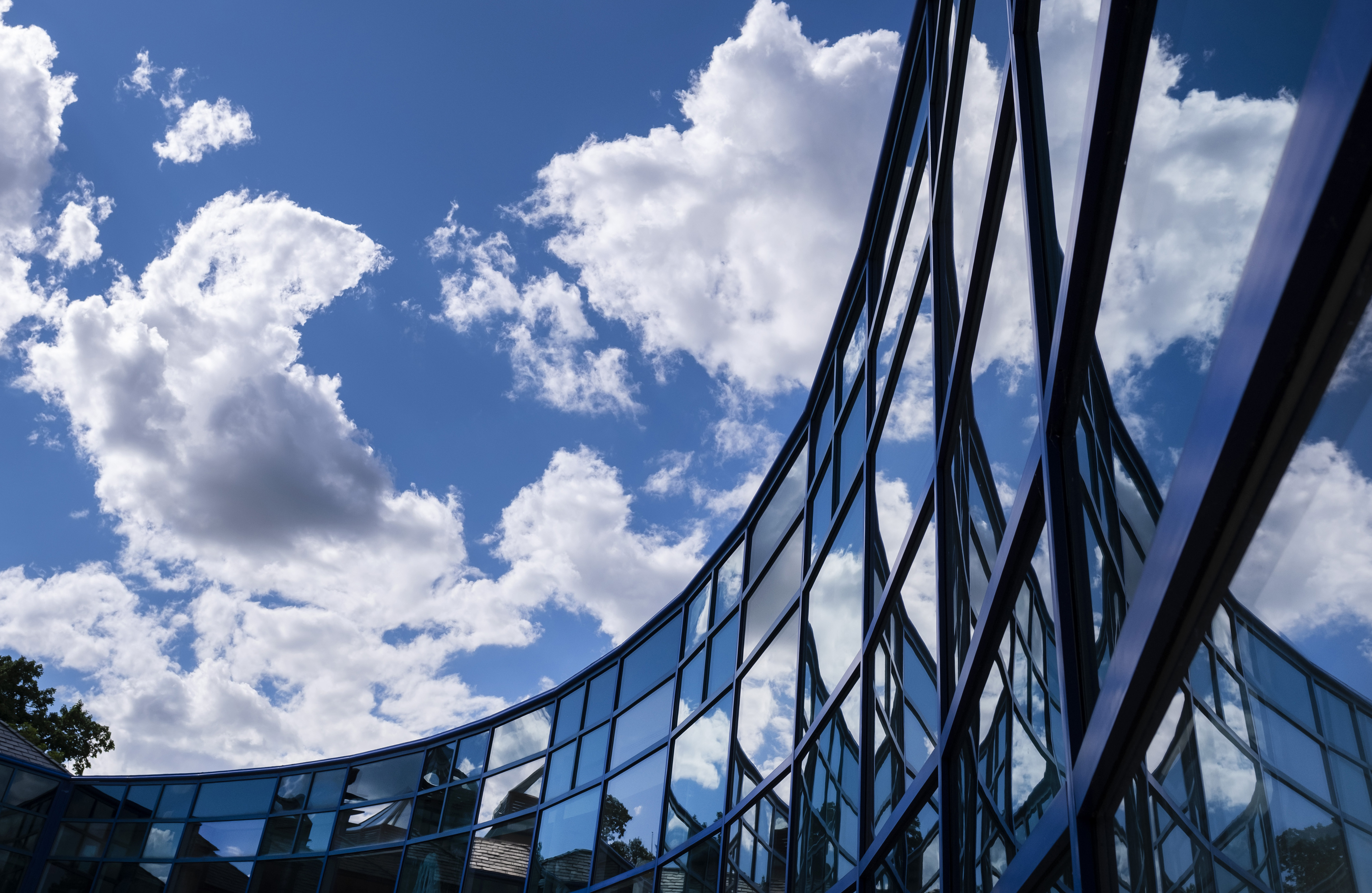 The Wriston Art Center’s windows reflect the clouds Tuesday, June 22, 2021. Photo by Danny Damiani