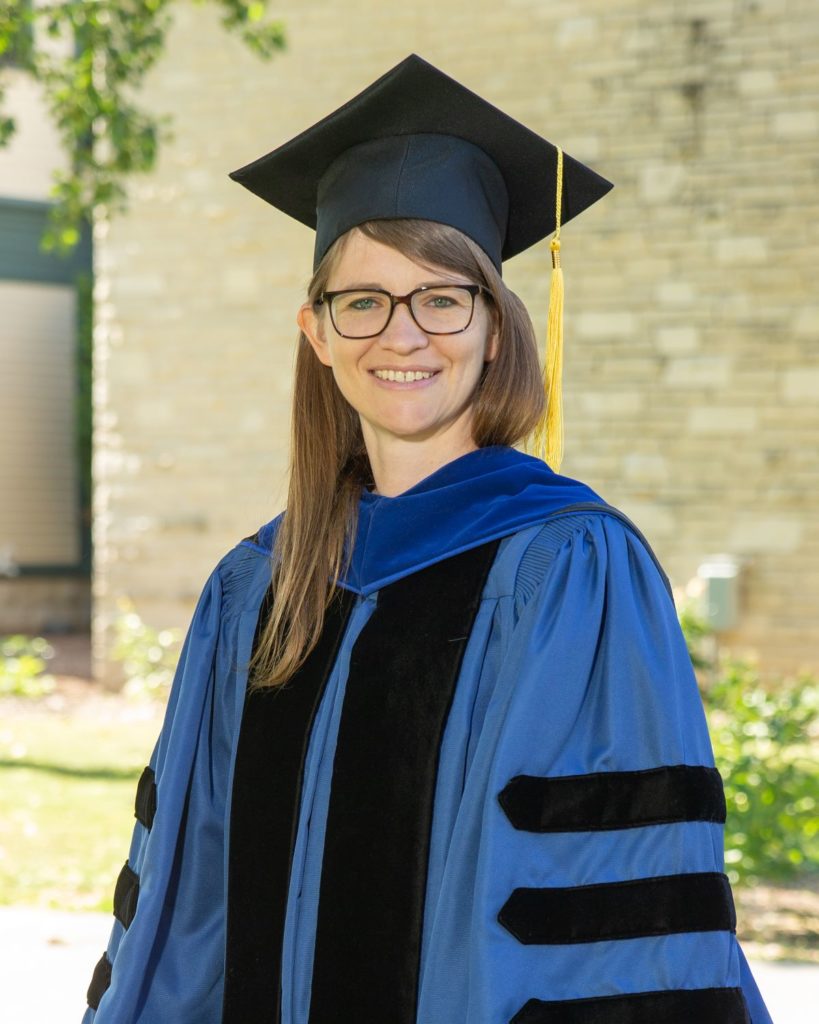 Rebecca Perry in academic regalia 