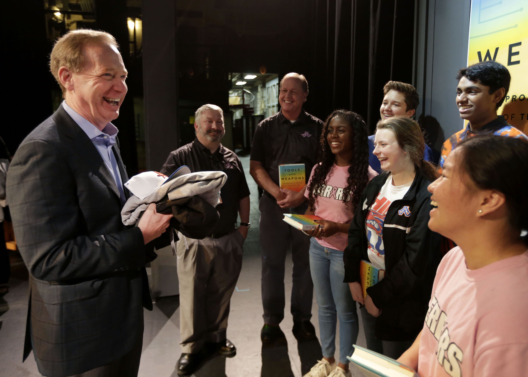 Microsoft President Brad Smith shares a laugh with students from Appleton West High School on the stage of Stansbury Theatre following his book discussion