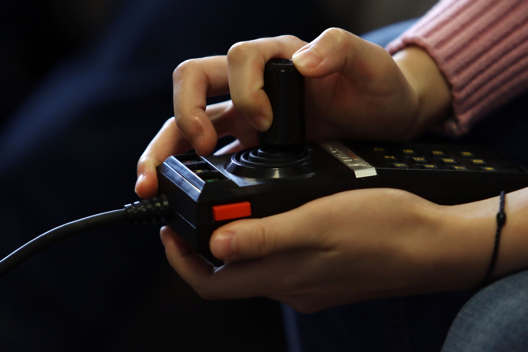 An Atari 5200 controller is used to play “Missile Command.”