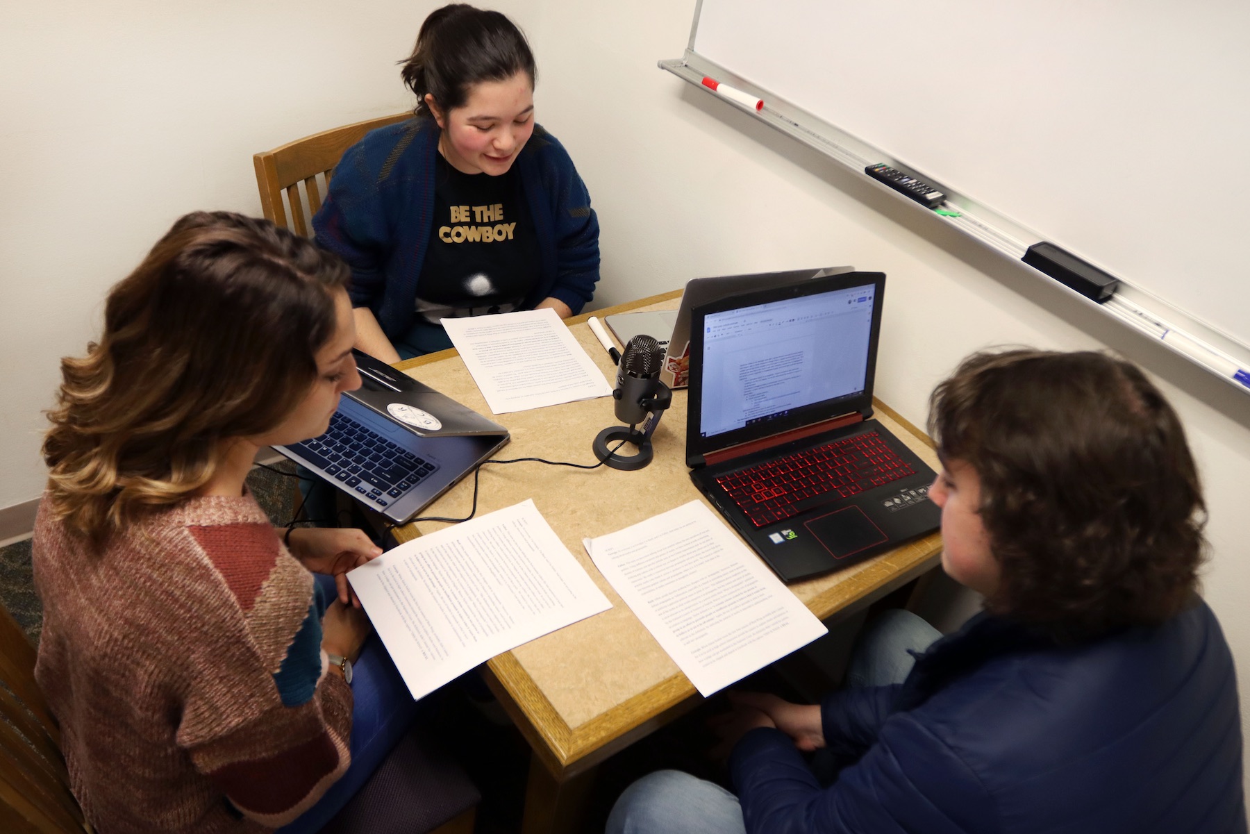 From left: Fallon Sellers ’20, Georgia Greenberg ’20, and Basil Eastman-Kiesow ’20 record a podcast for their War and Pop Culture class taught by government professor Jason Brozek.