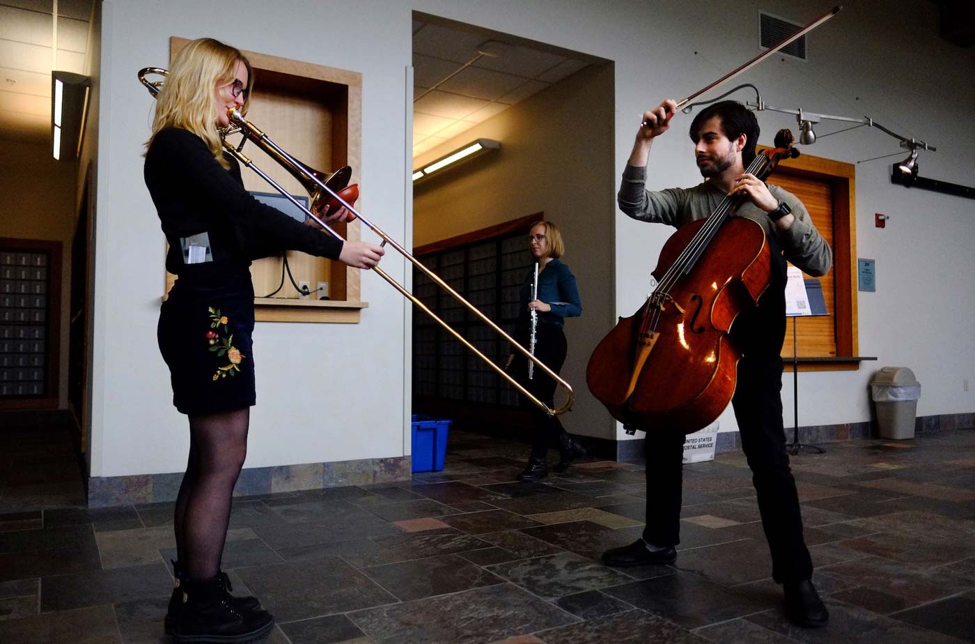 Cellist and trombone performers in Warch Campus Center