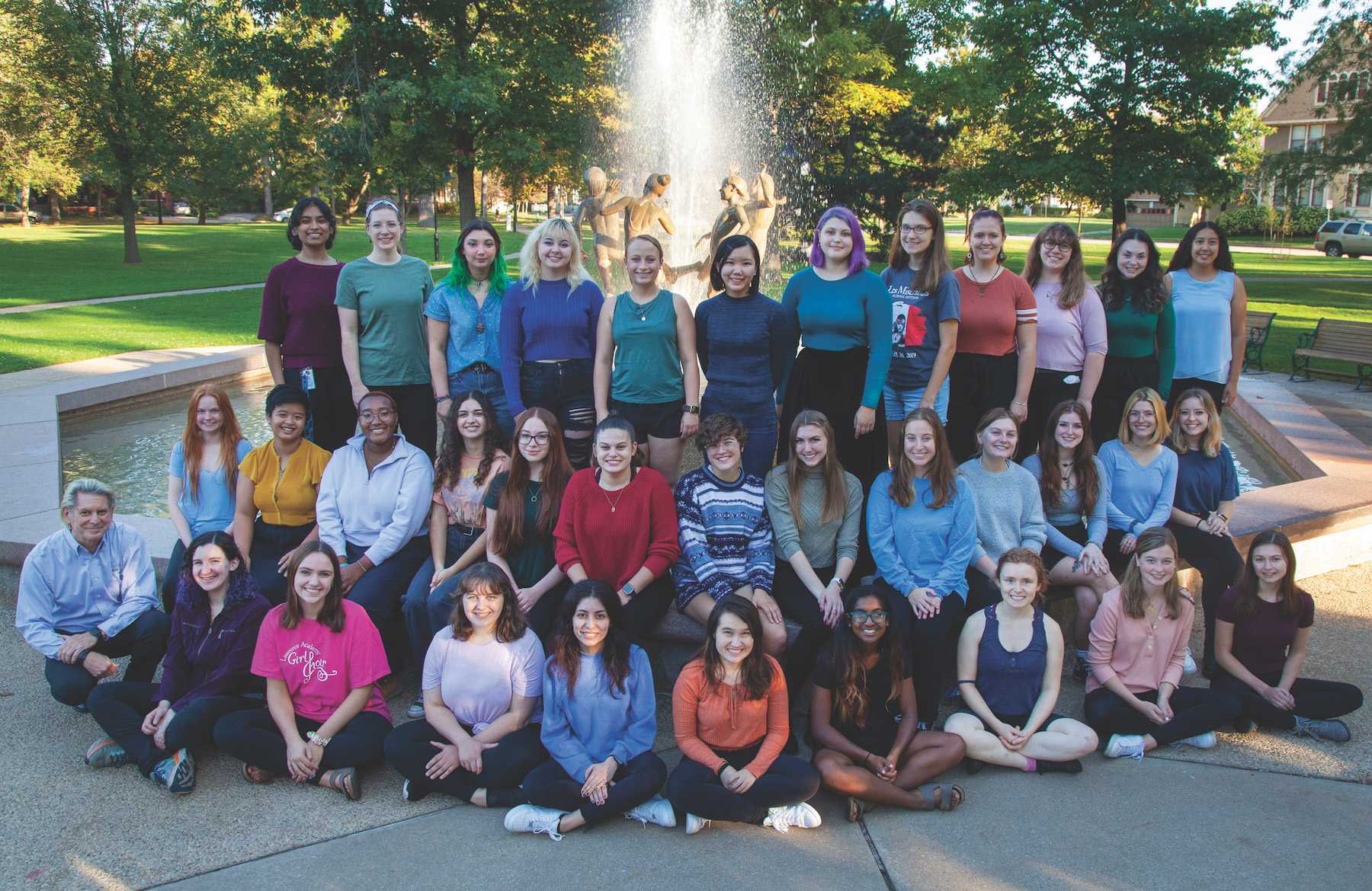 Cantala choir poses for a photo in front of the fountain in City Park.