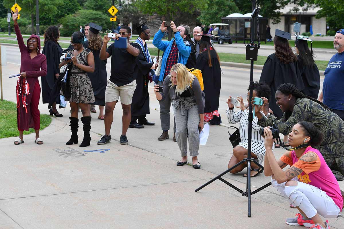 People taking photos at Commencement ceremony