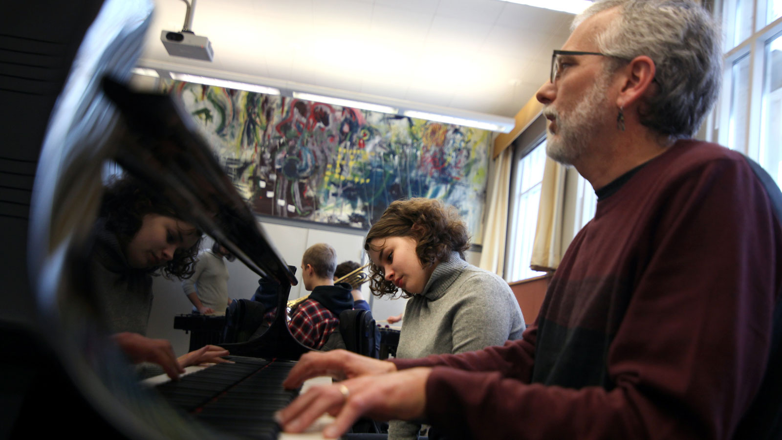 Sonja Klusman plays the piano with Matt Turner, Instructor of Music, during his Applied Musicianship II class