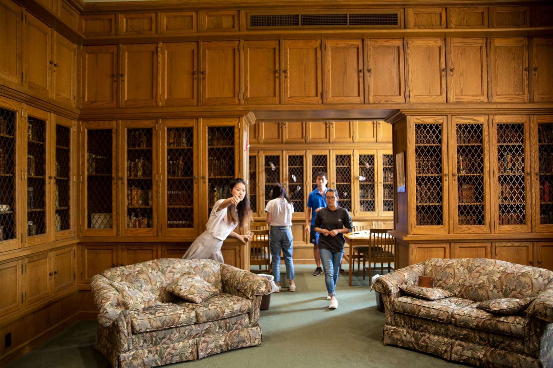 Students guiding other students through the Escape Room in the library.