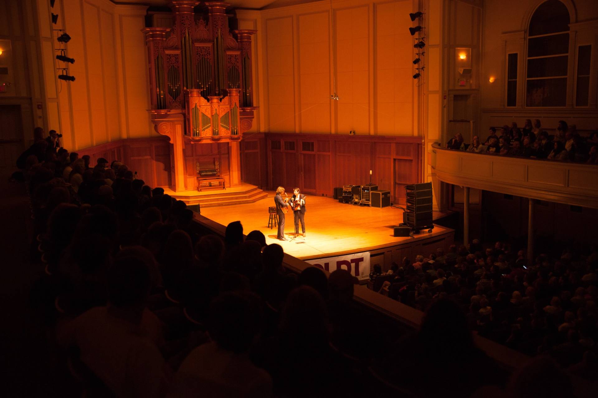 Two musicians perform on stage in Memorial Chapel during the Mile of Music.