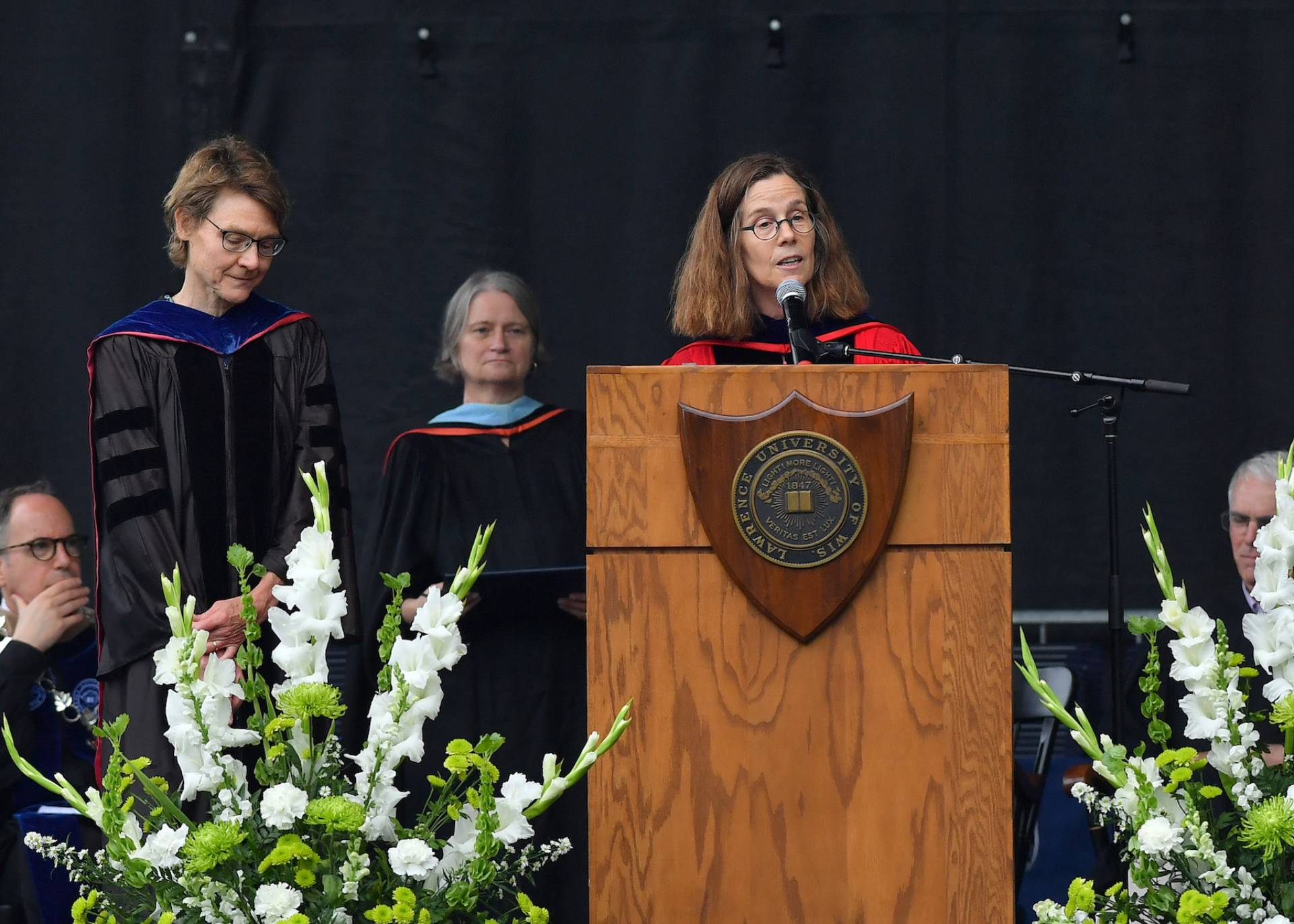 Provost and Dean of Faculty Catherine Kodat announcing faculty award for Marcia Bjornerud during Commencement ceremony.