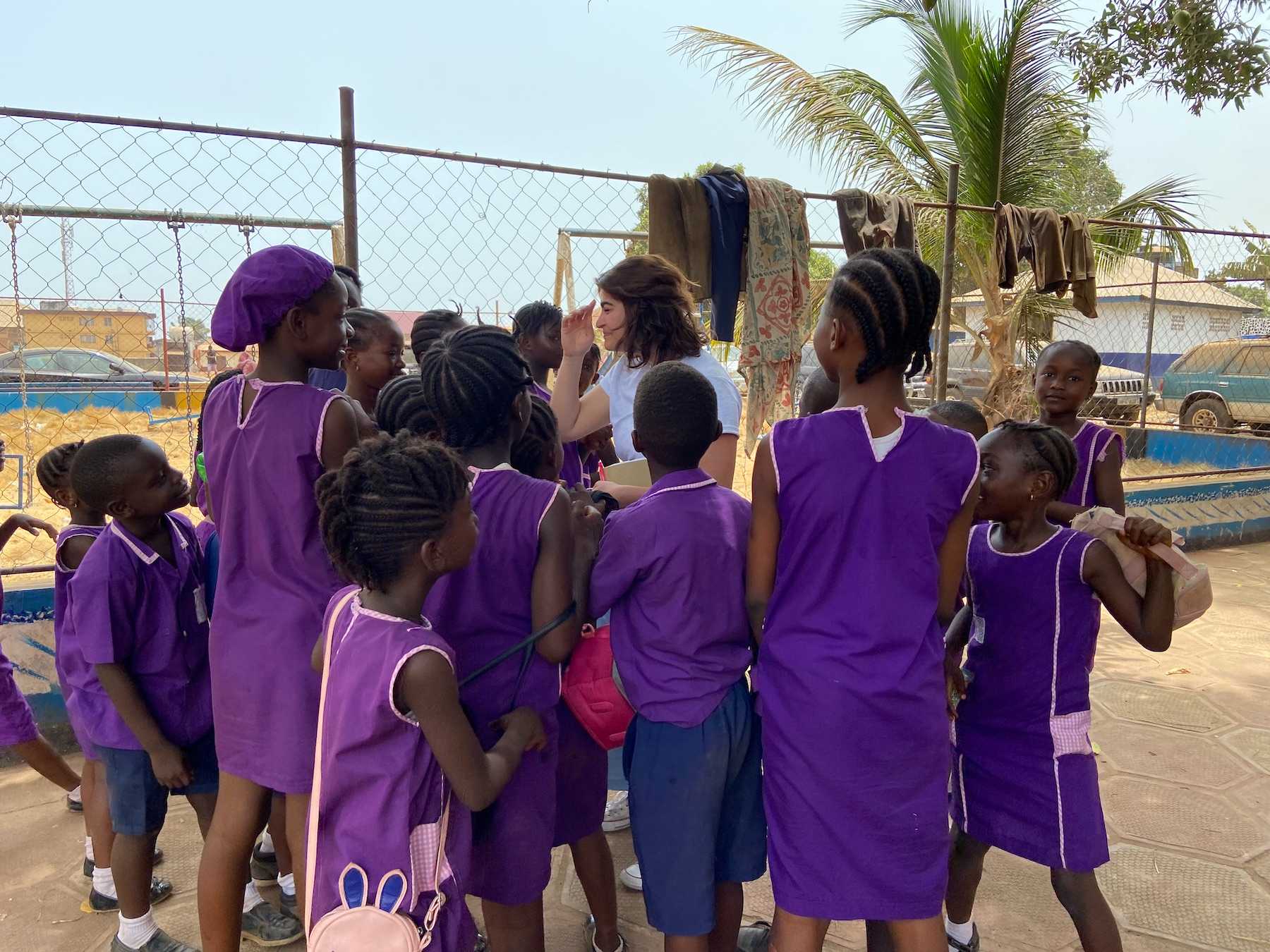 Marife Entenza-Sierra talks with a group of students at the FAWE Primary School.