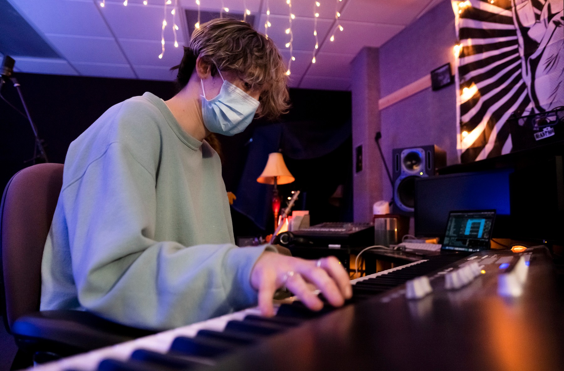 Jonah Trudeau plays the keyboard in SOL Studios while working on a song with VOODIS bandmates. 