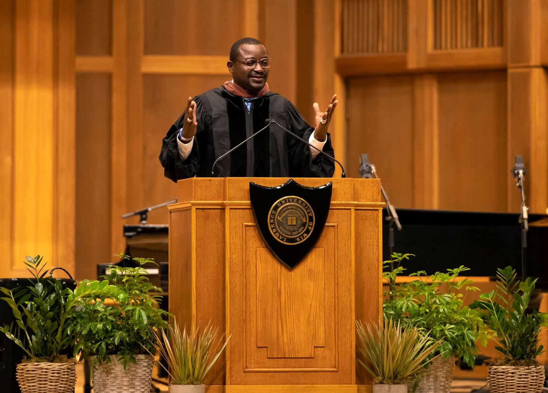 Robert Battle speaks at the podium on stage of Memorial Chapel.