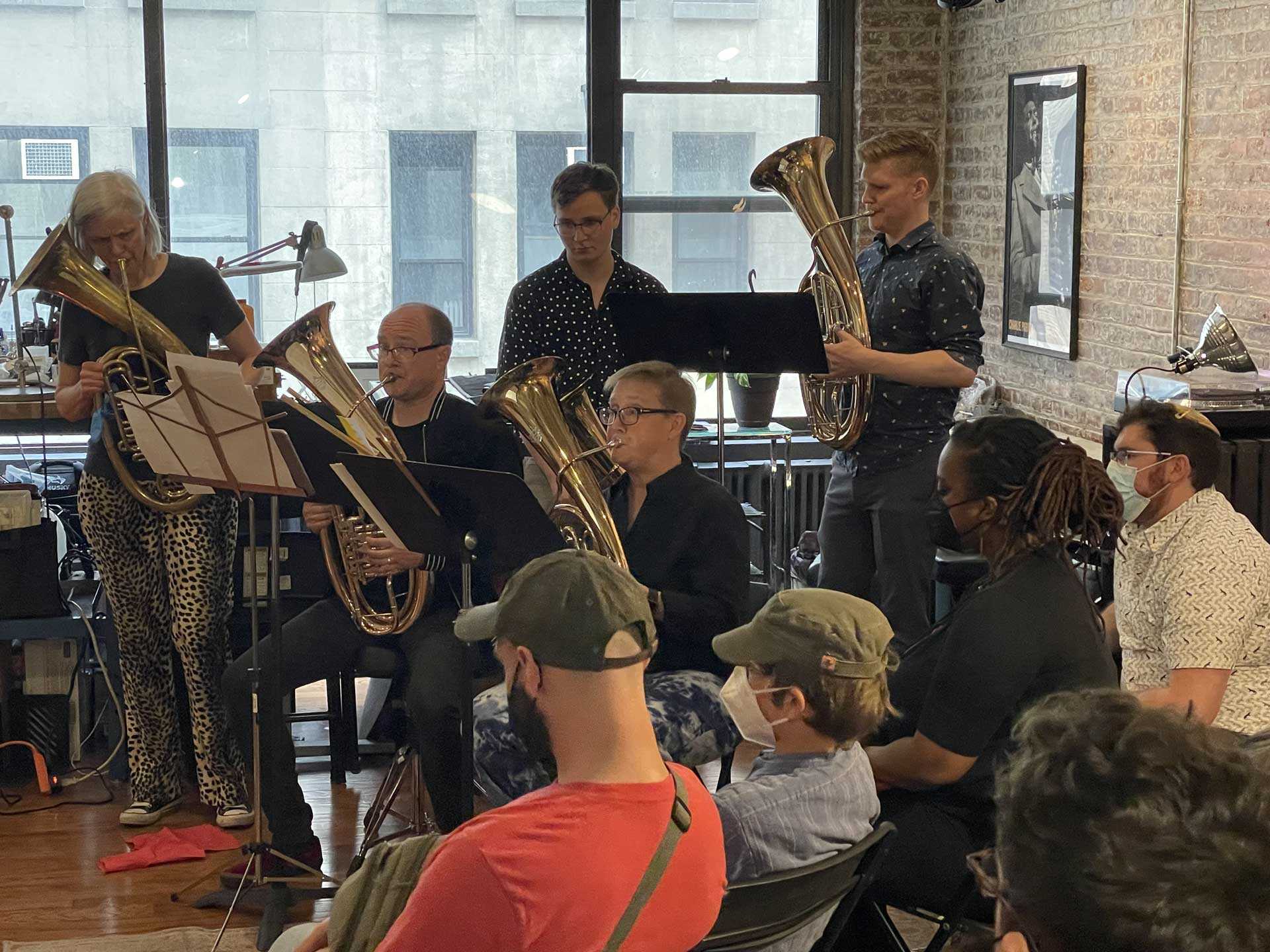 Members of the tuben quintet perform for an audience at the New York album release party. 