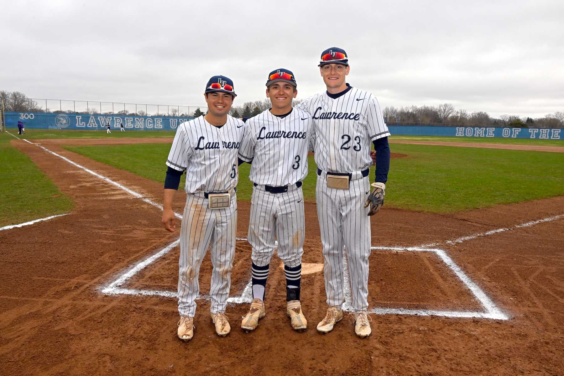 Lawrence seniors pose near home plate at Whiting Field: from left, Spenser Ross, Colin Wieska and Jacob Charon.