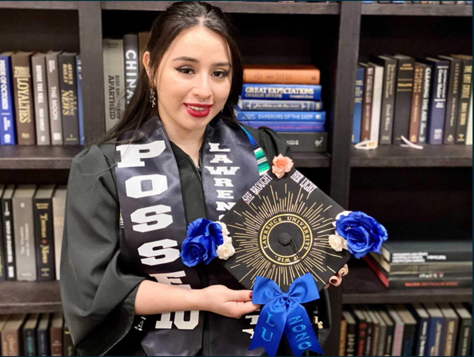Samantha Lizbeth Torres poses for a photo with her cap and gown in 2020.