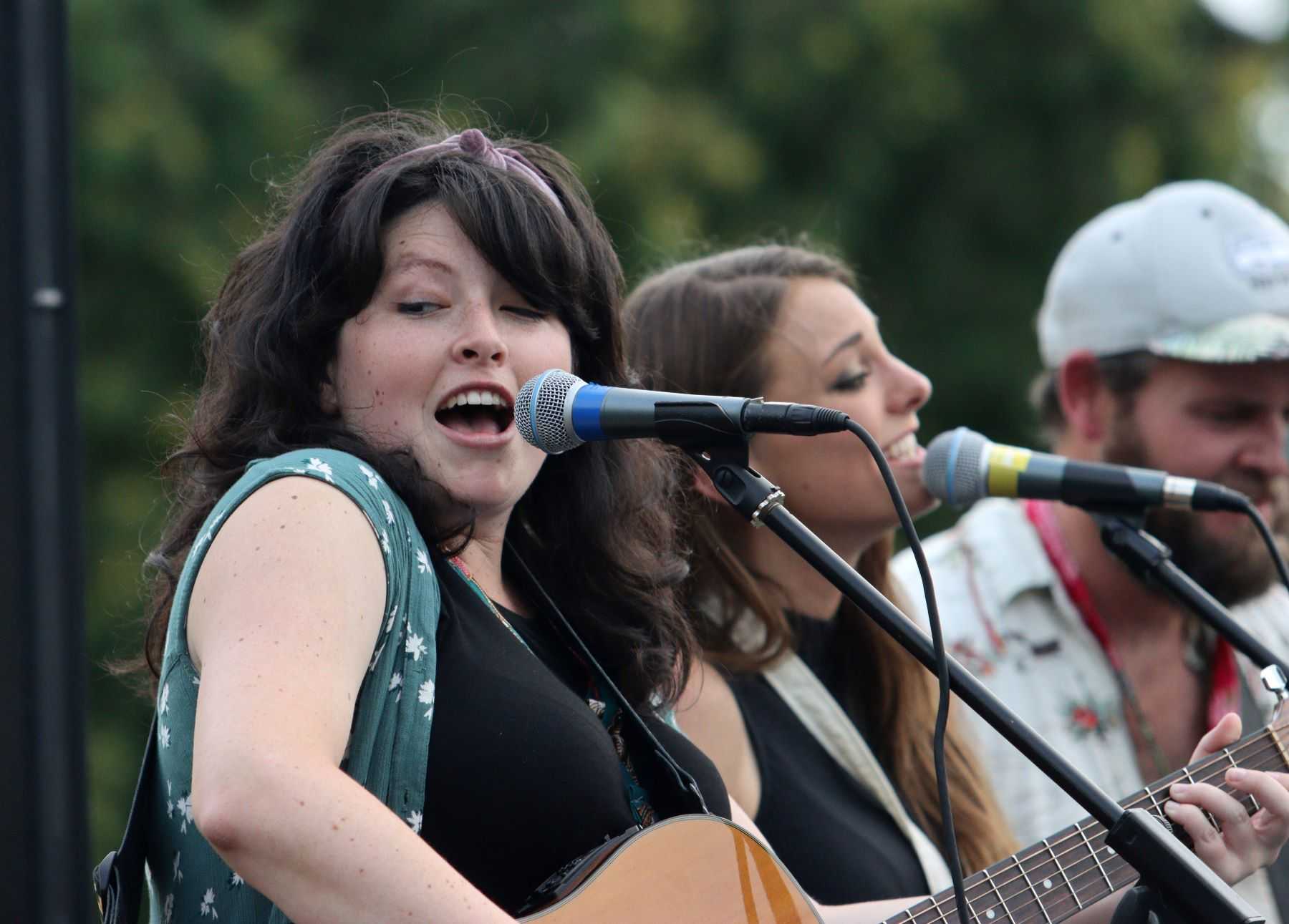 Claire Kelly and her bandmates sing during 2021 Mile of Music on the Lawrence Lawn.