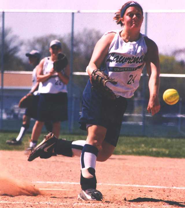 Sara Schye pitches in a Lawrence softball game.